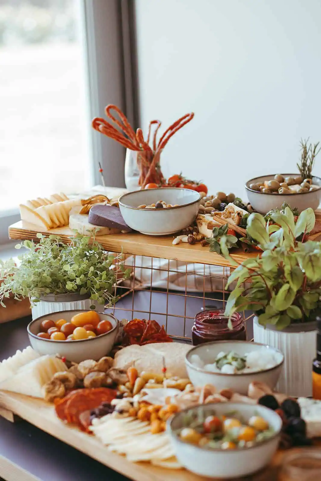 Gourmet catering table with cheeses, seafood and appetizers prepared by Catering Majetic